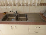 Good Condition Kitchen with rangehood, fish poven, double sink, taps